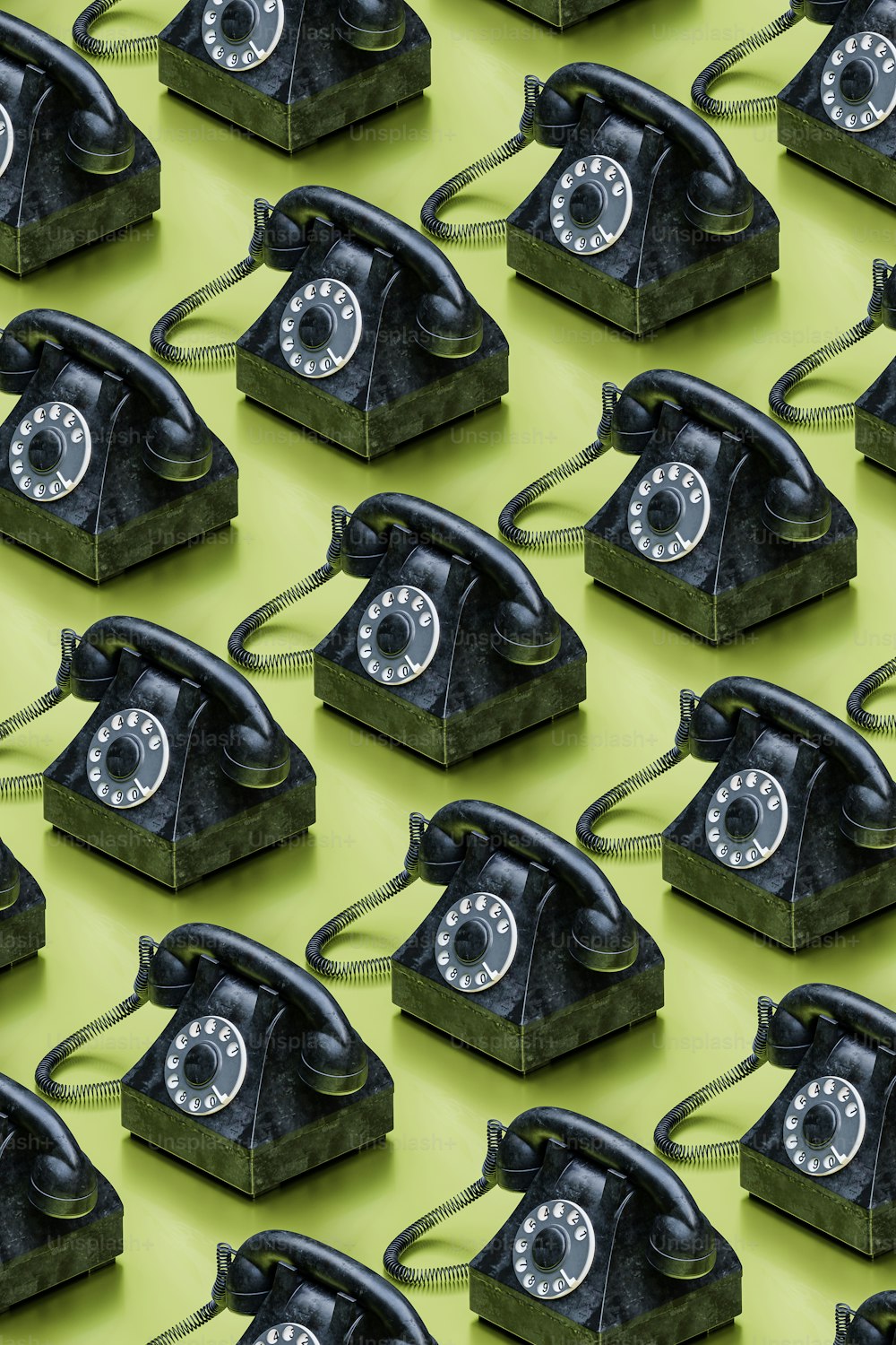 a group of old fashioned telephones sitting on top of each other