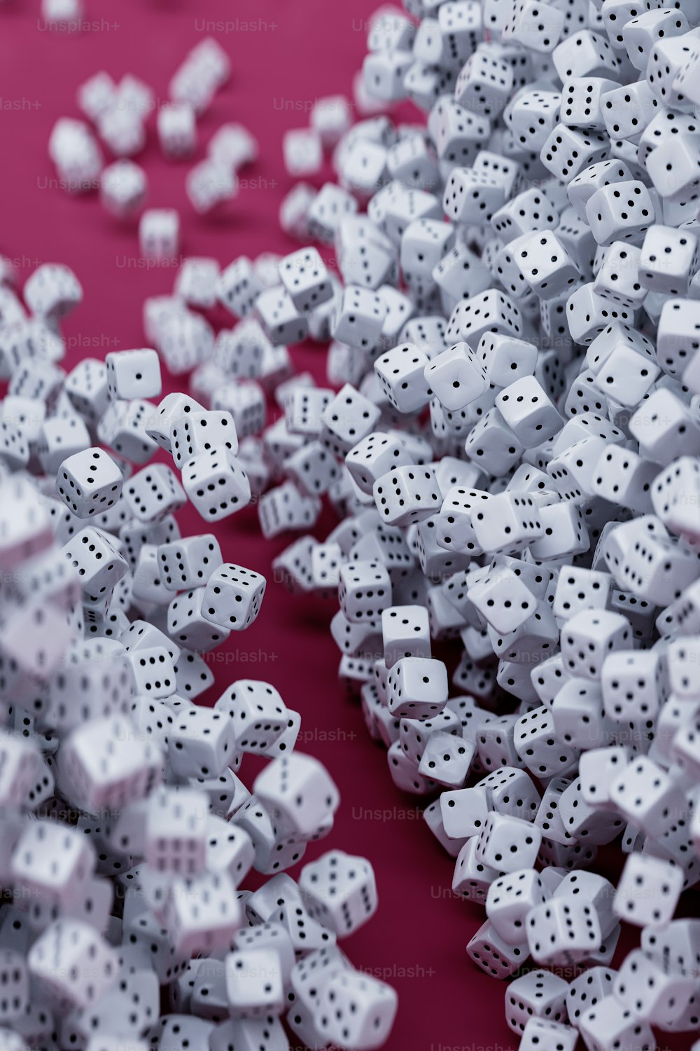 a group of white dices sitting on top of a red table