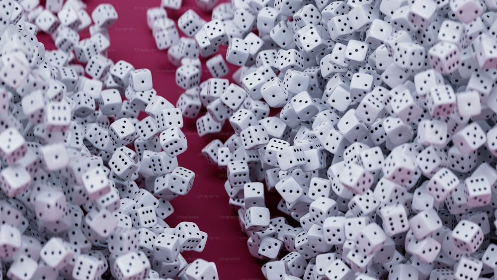 a group of white dices with black dots on them
