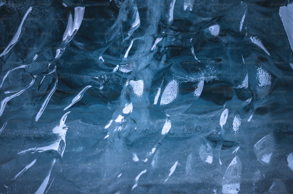 a close up of ice and water on the ground