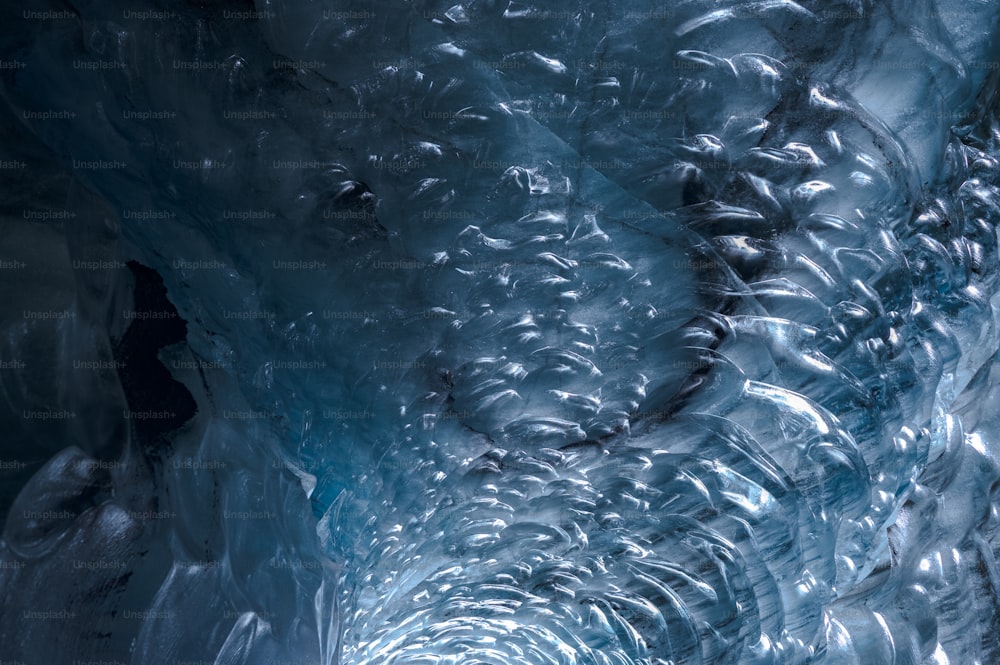 an ice cave with water flowing down it