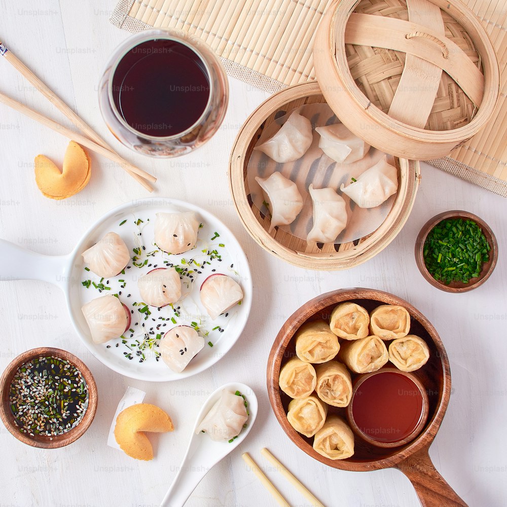 a table topped with bowls of food and chopsticks