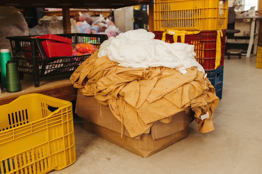 a pile of clothes sitting on top of a floor