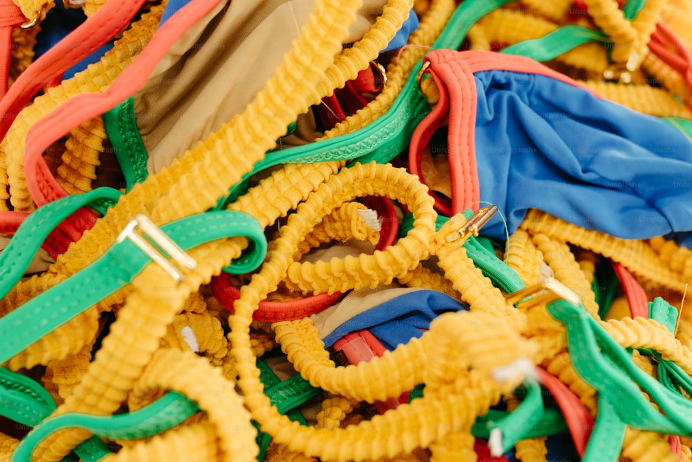 a pile of yellow and green cords and ties