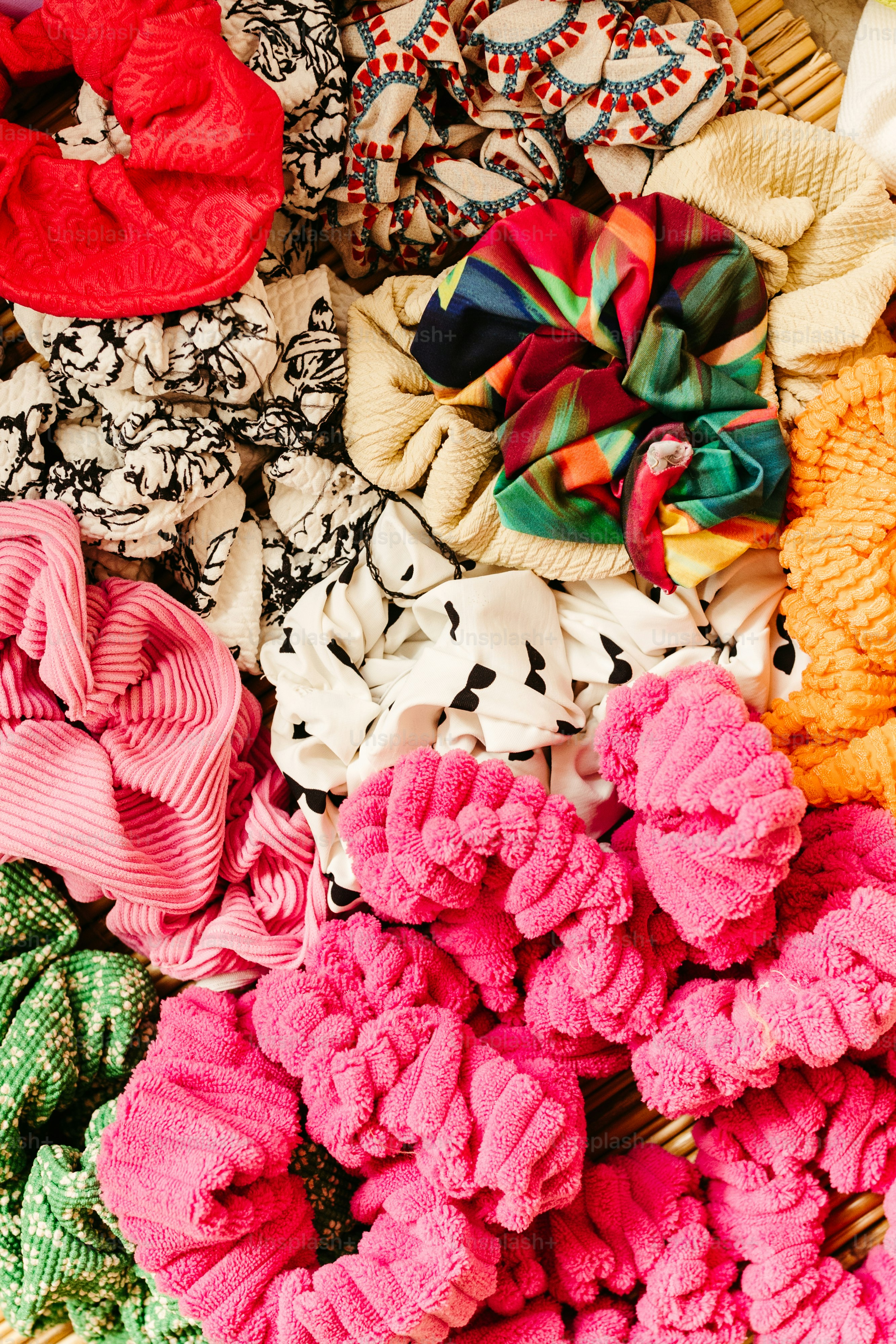 a basket filled with lots of different colored hair bows