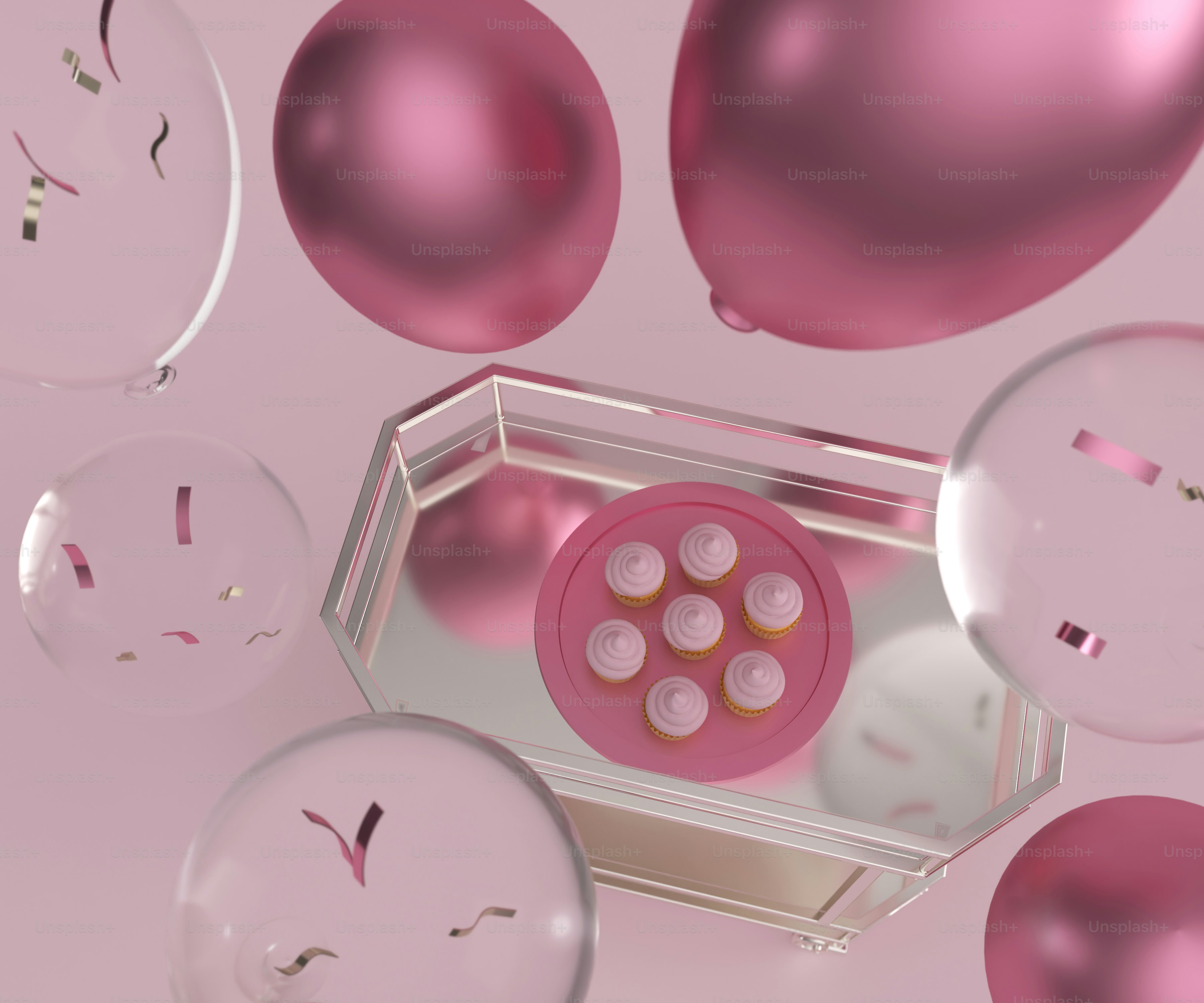 a bunch of pink balloons floating in the air