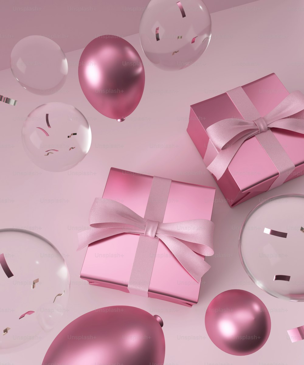 a pink gift box with a bow and a ribbon