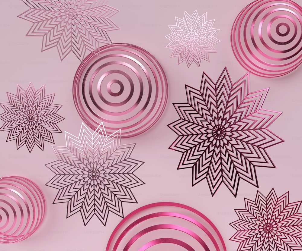a group of pink and black ornaments on a pink background