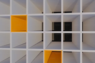 Una pared blanca con cuadrados amarillos y negros