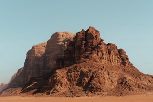 a large rock formation in the middle of a desert