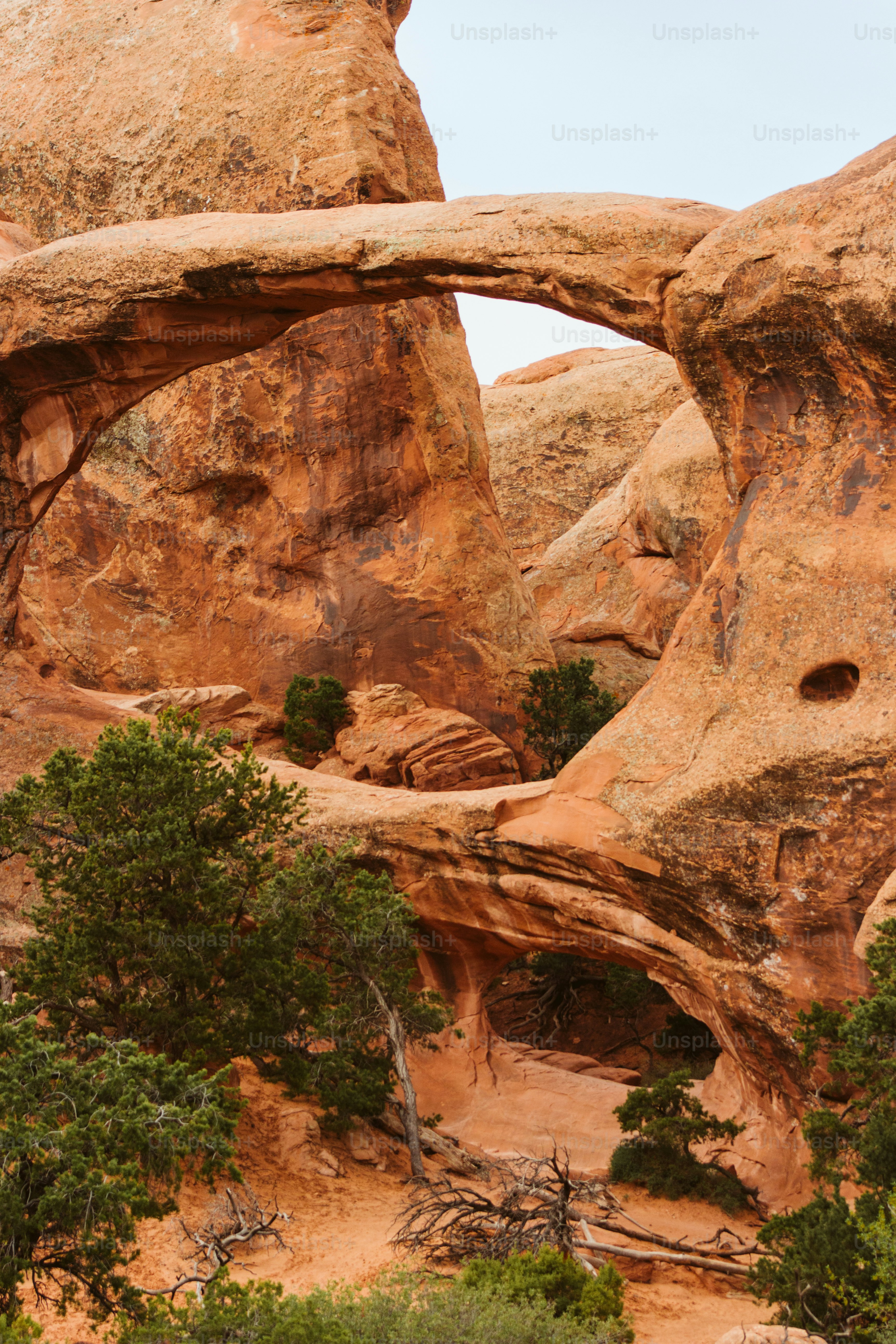 a large rock formation with an arch in the middle of it