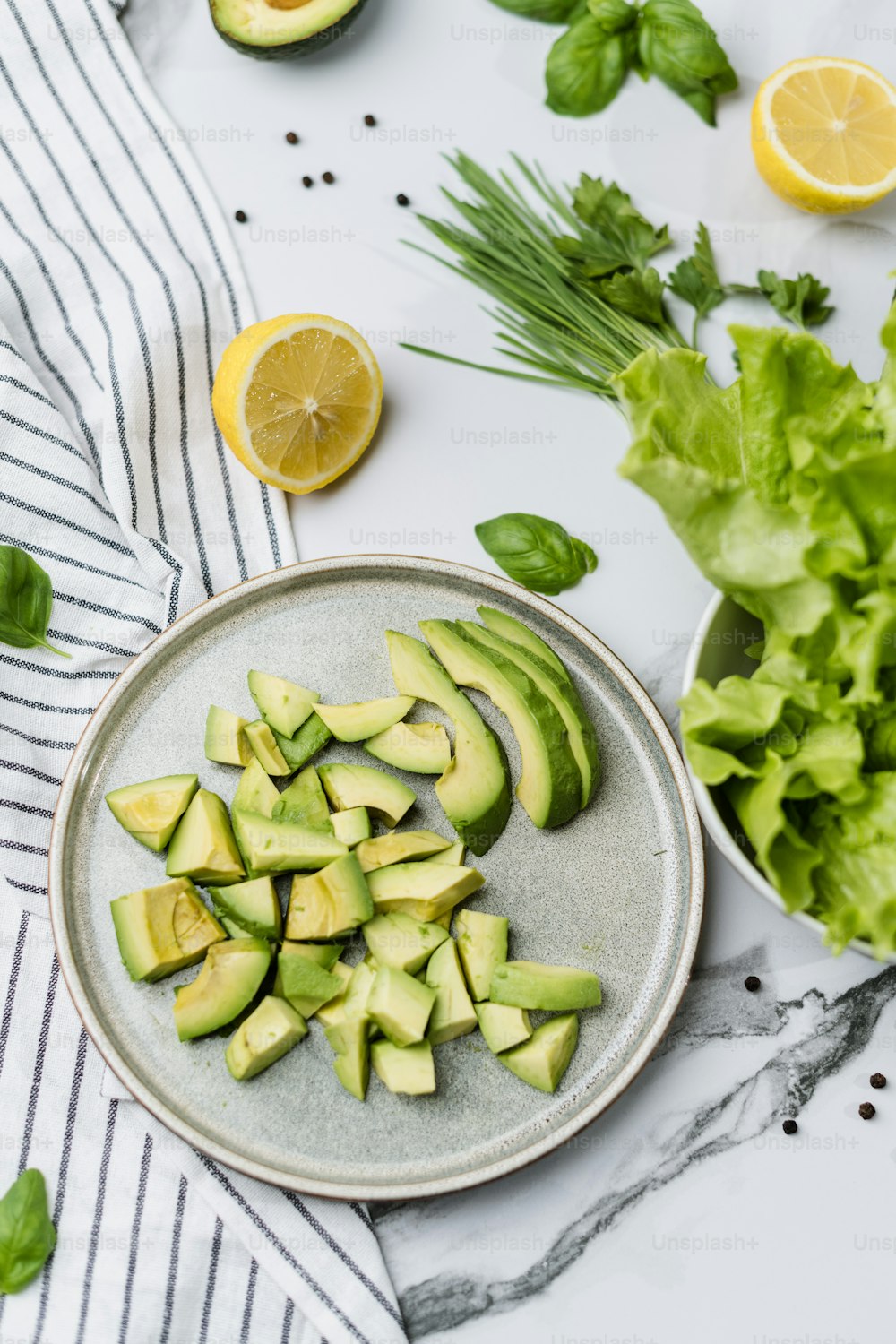 a plate of sliced avocados on a table