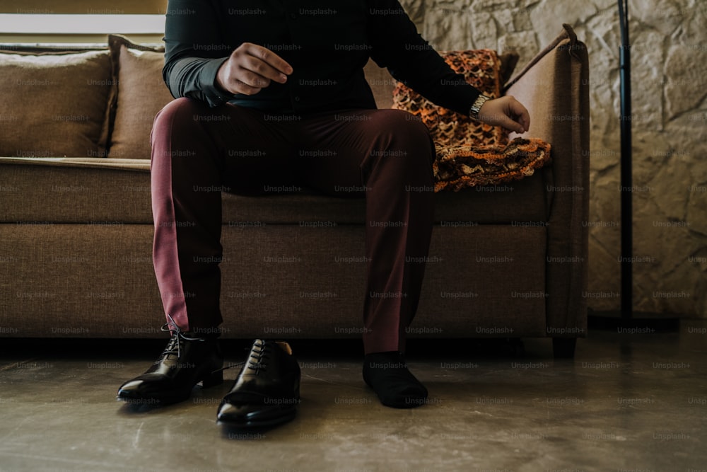 a man sitting on a couch in a living room