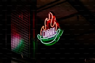 a neon sign that says curry on it