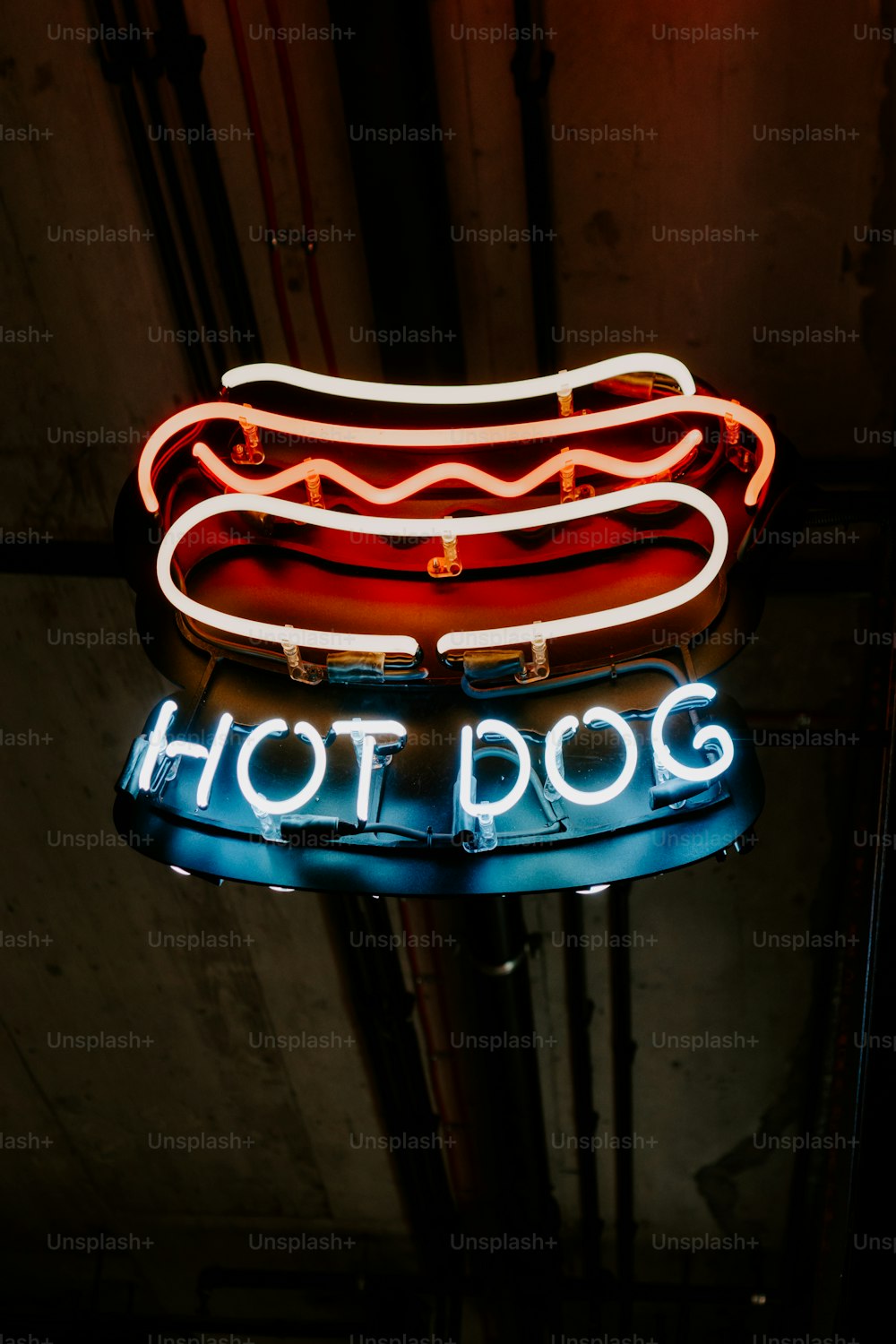 a neon sign that says hot dog on it