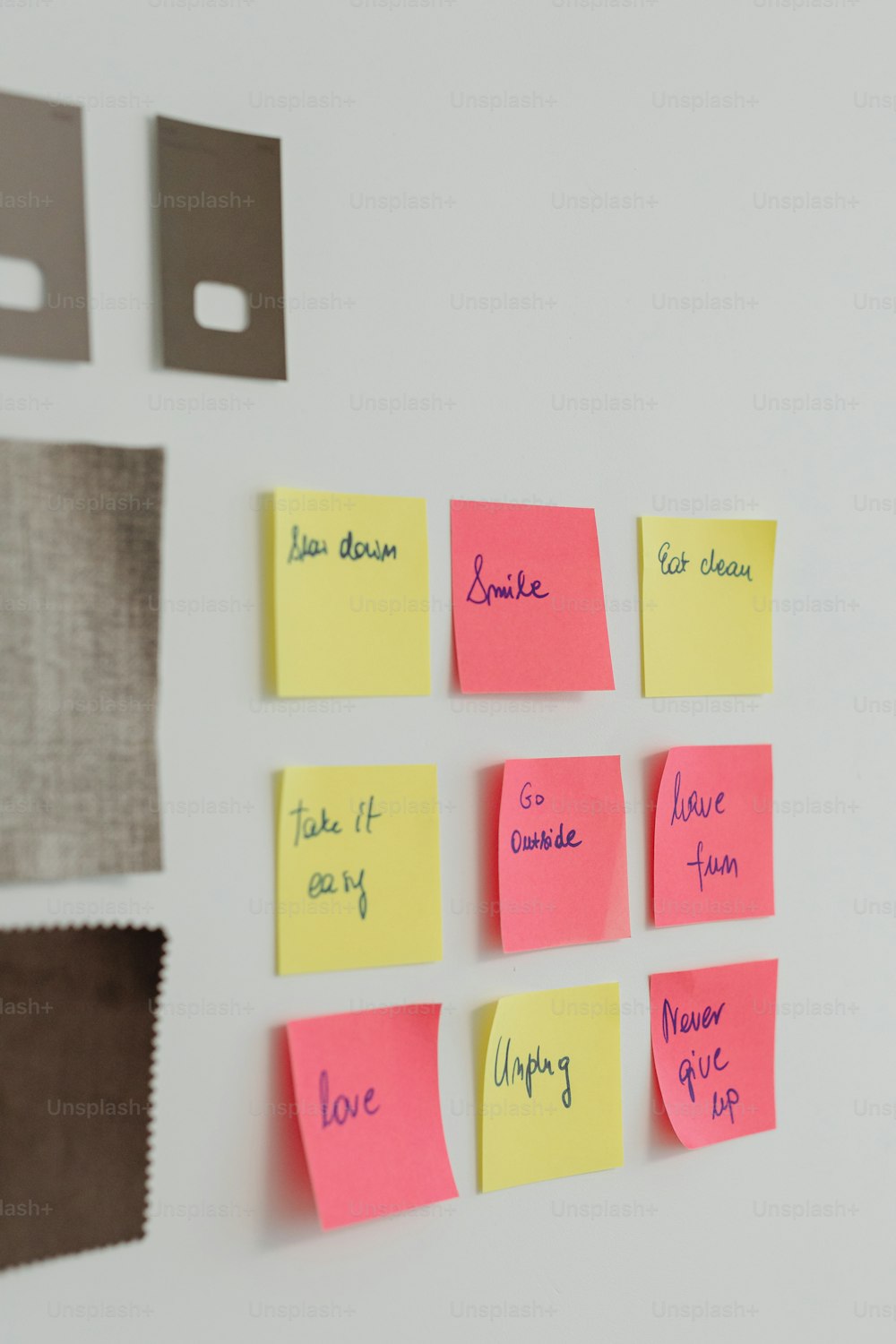 sticky notes pinned to a white wall