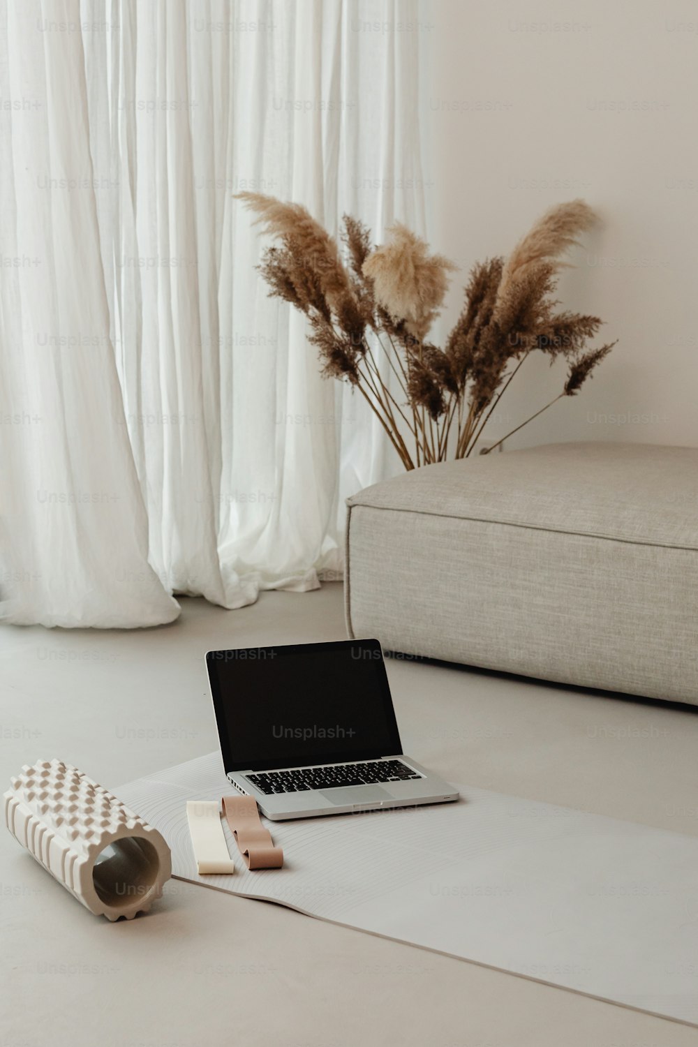 a laptop computer sitting on top of a white table