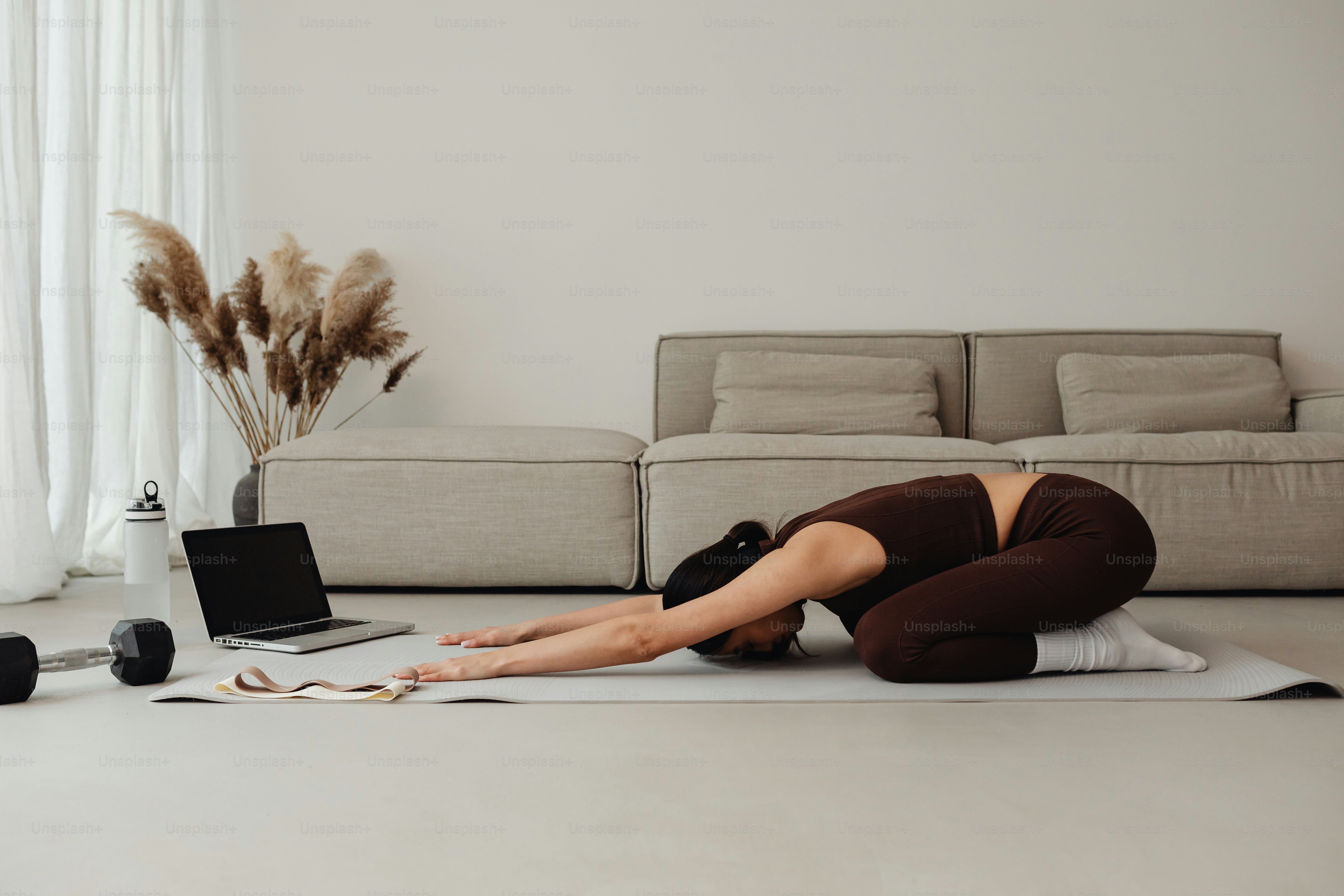 Person performing gentle morning mobility exercises to reduce waking with back pain.