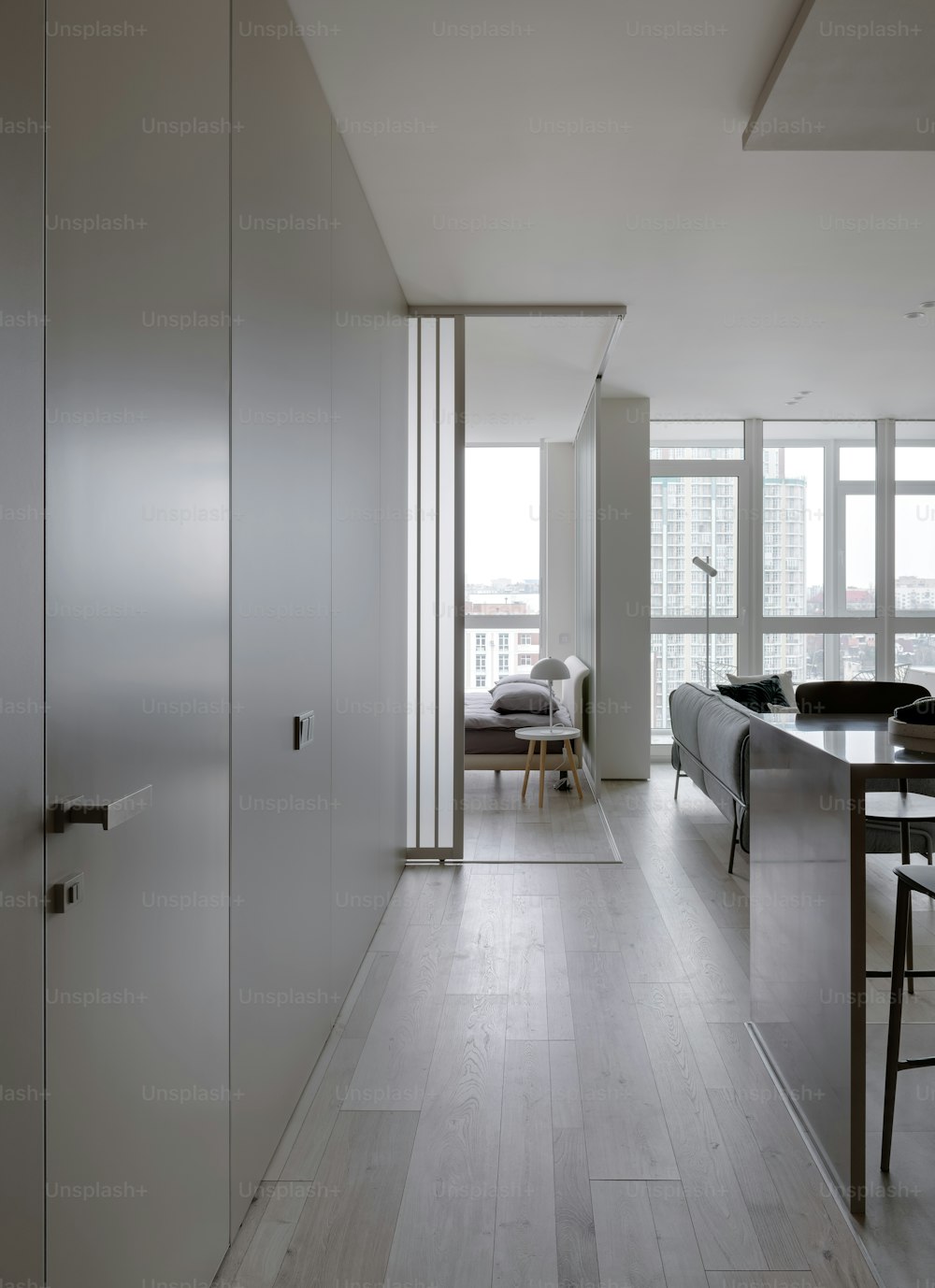 a kitchen with a table and chairs next to a window