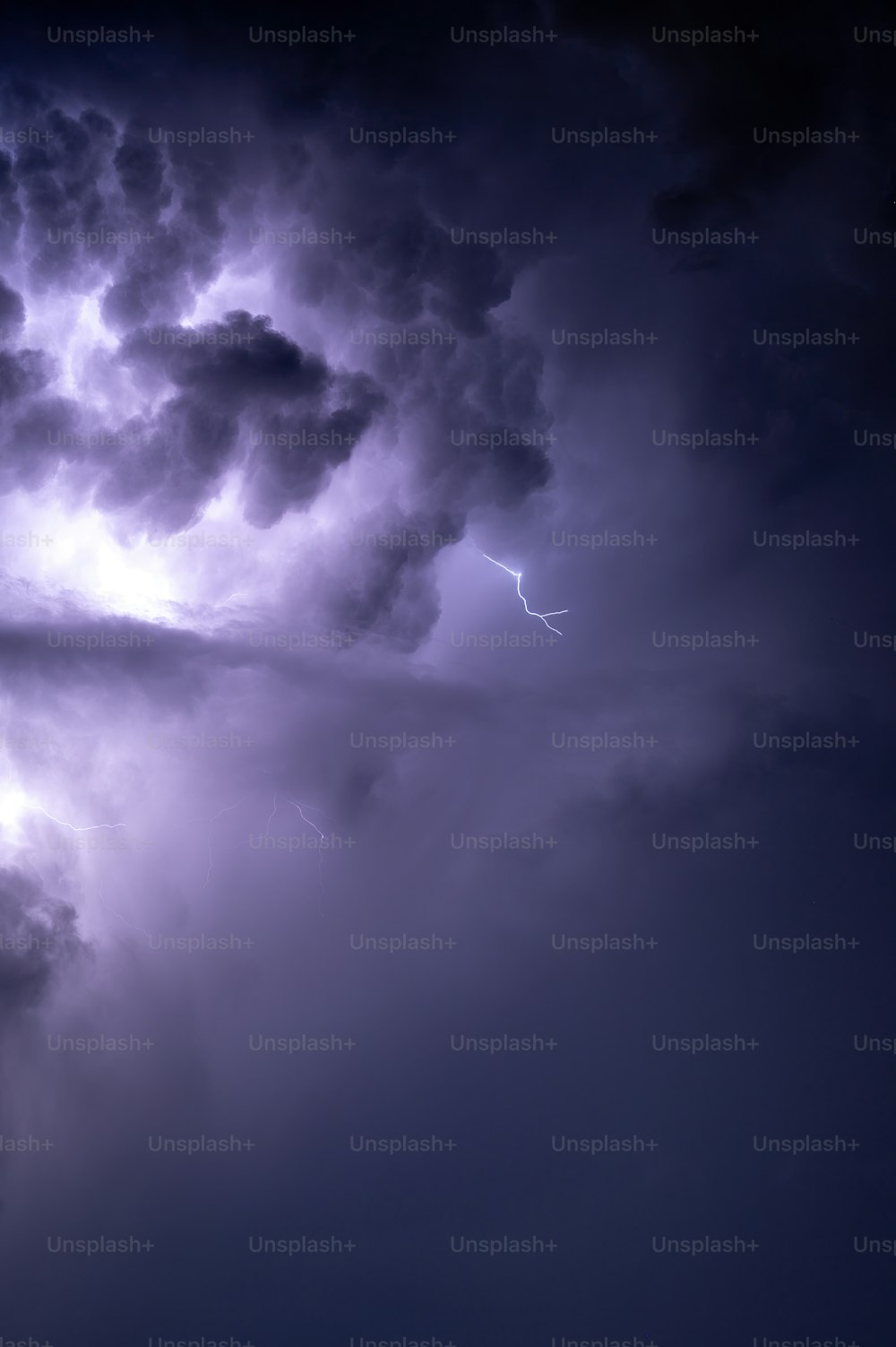 a lightning storm is seen in the sky