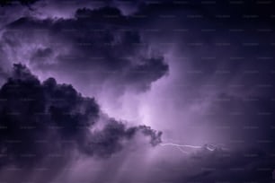 a purple sky with a lightning bolt in the middle of it