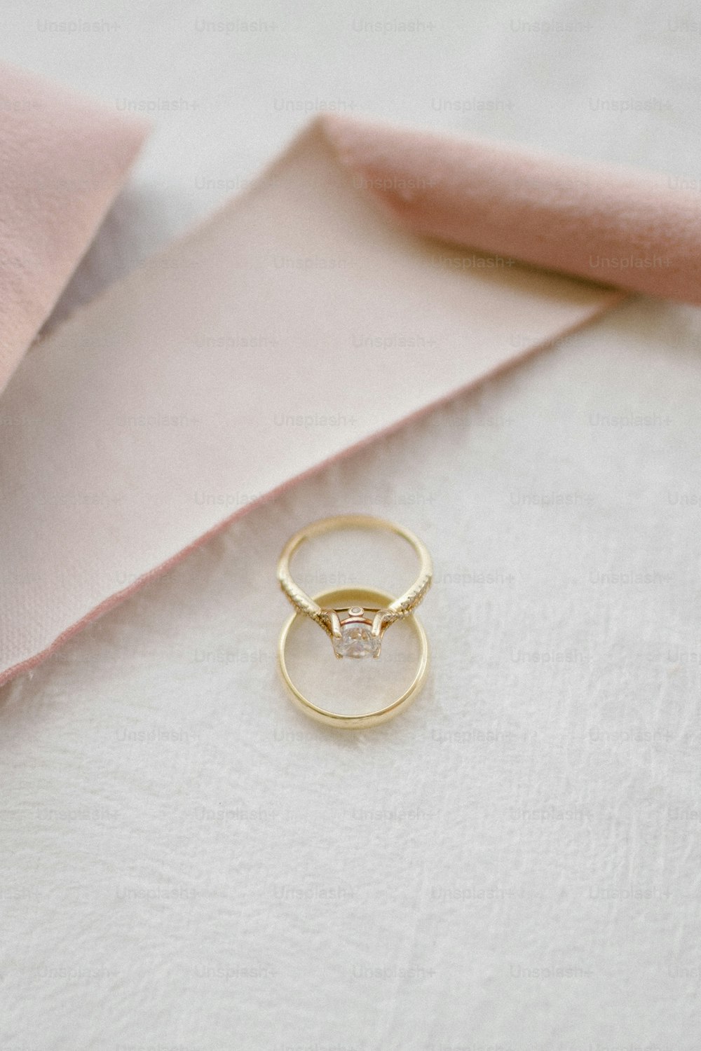 a close up of a gold ring with a diamond