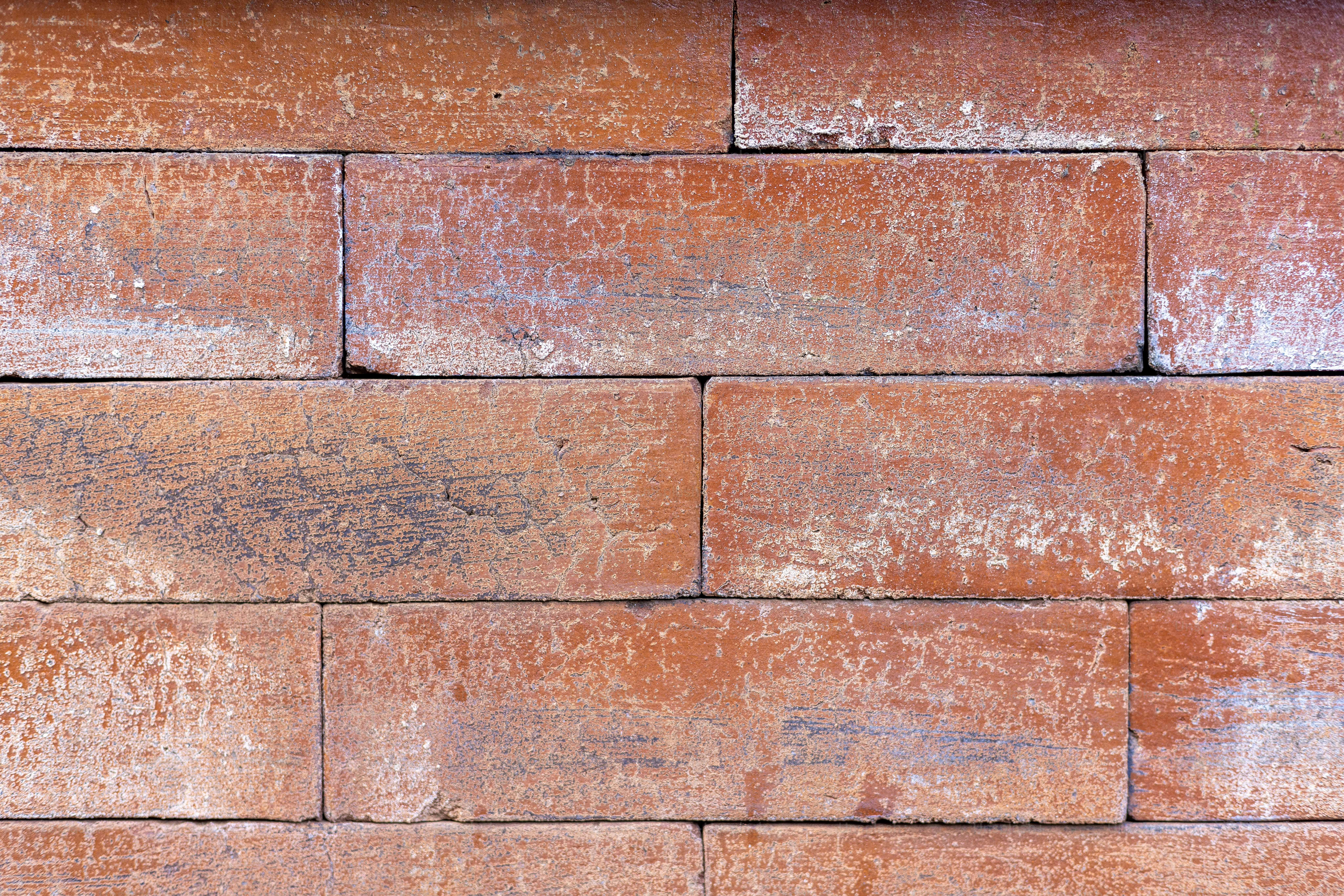 a close up of a red brick wall