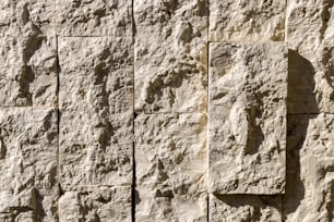 a close up of a wall made of stone blocks