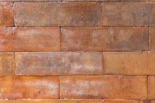 um close up de uma parede feita de tijolos