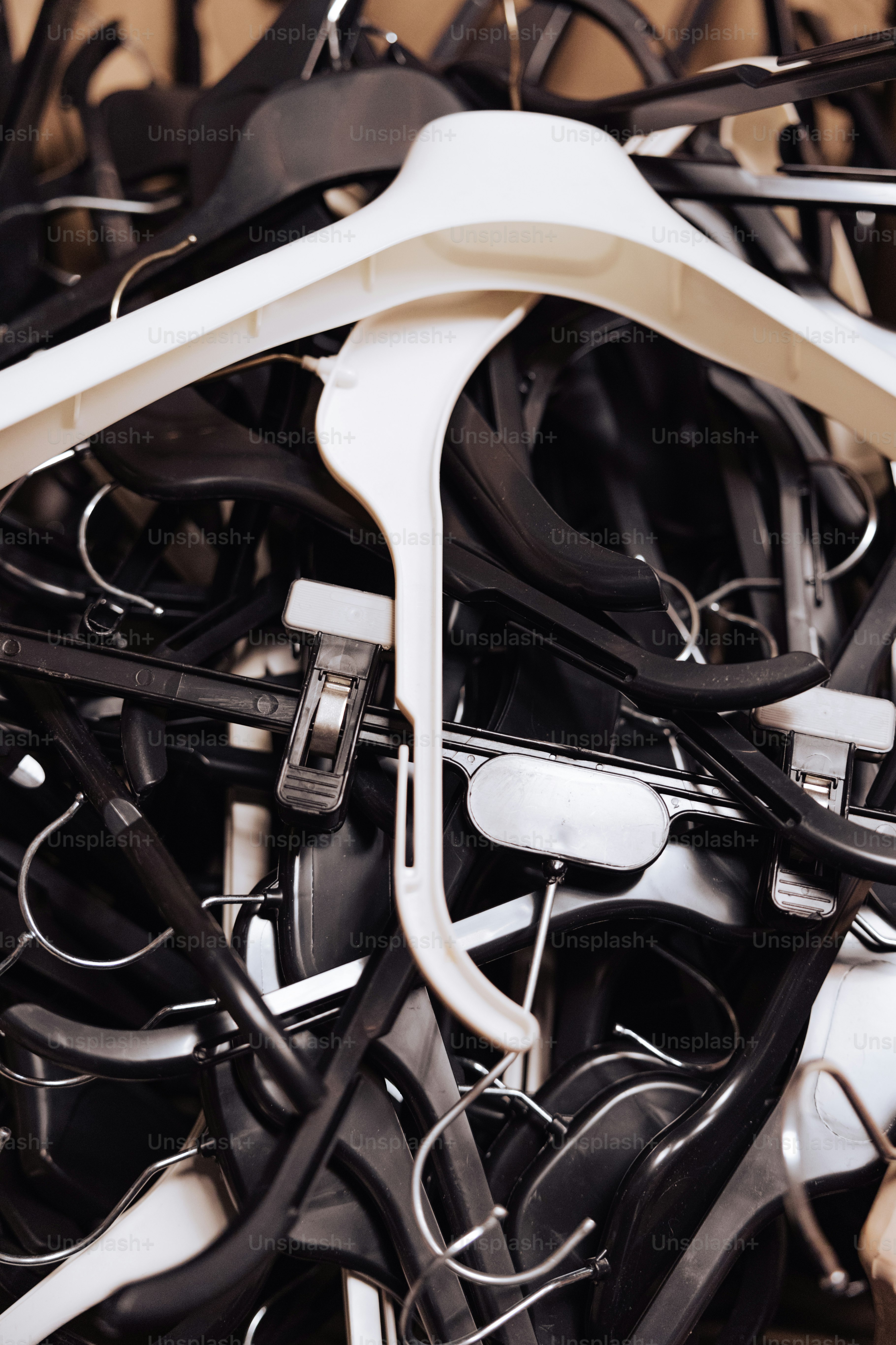 A pile of black and white wires and cords photo Coat hangers Image on