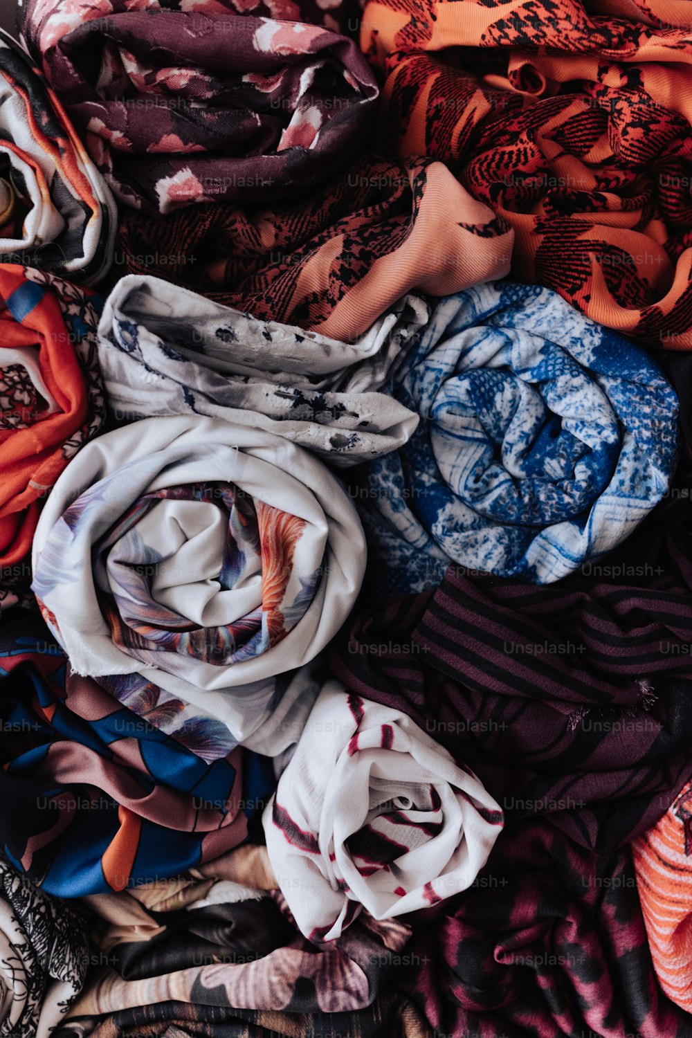 a pile of scarves sitting on top of each other