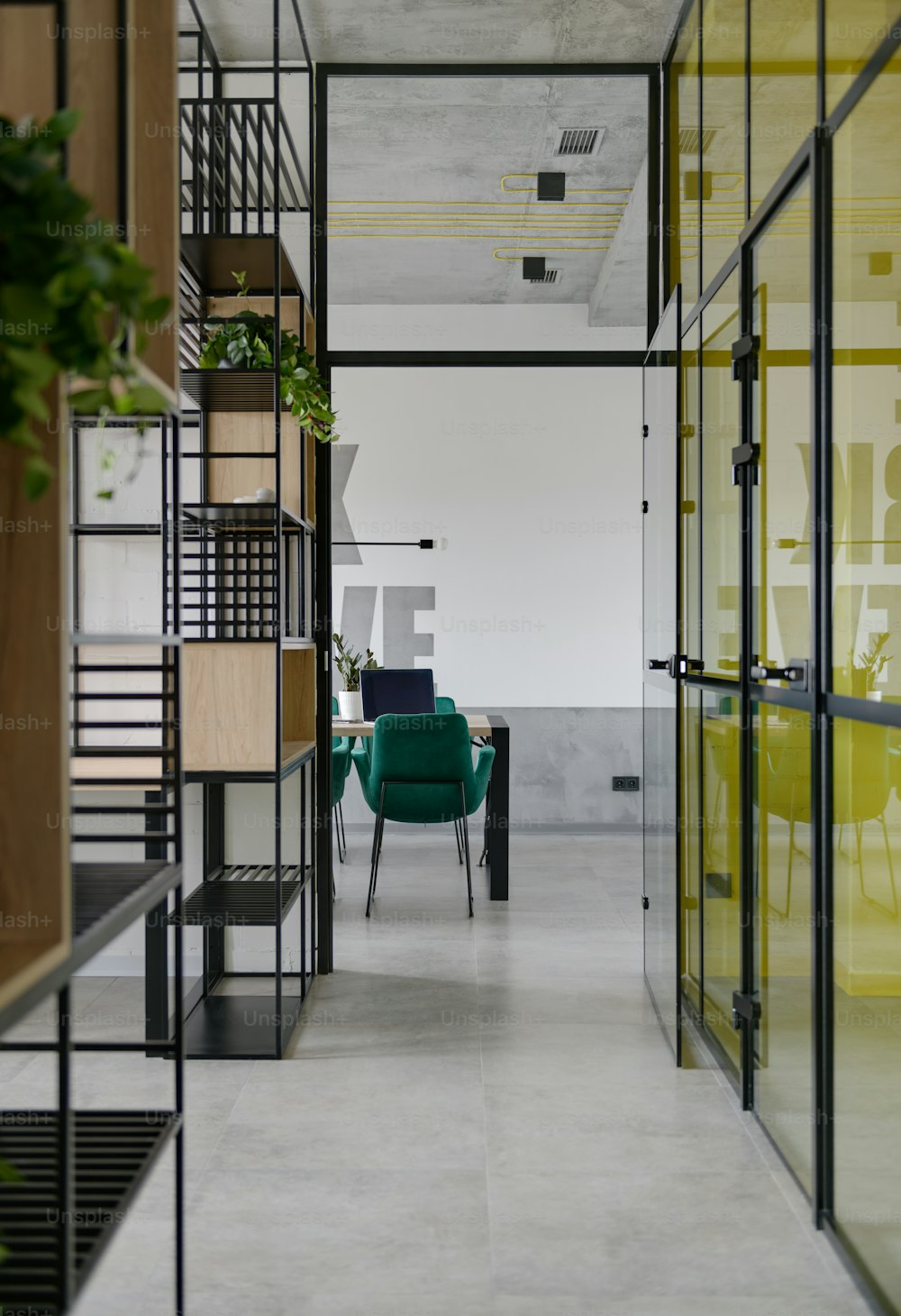 a green chair sitting in a room next to a green chair