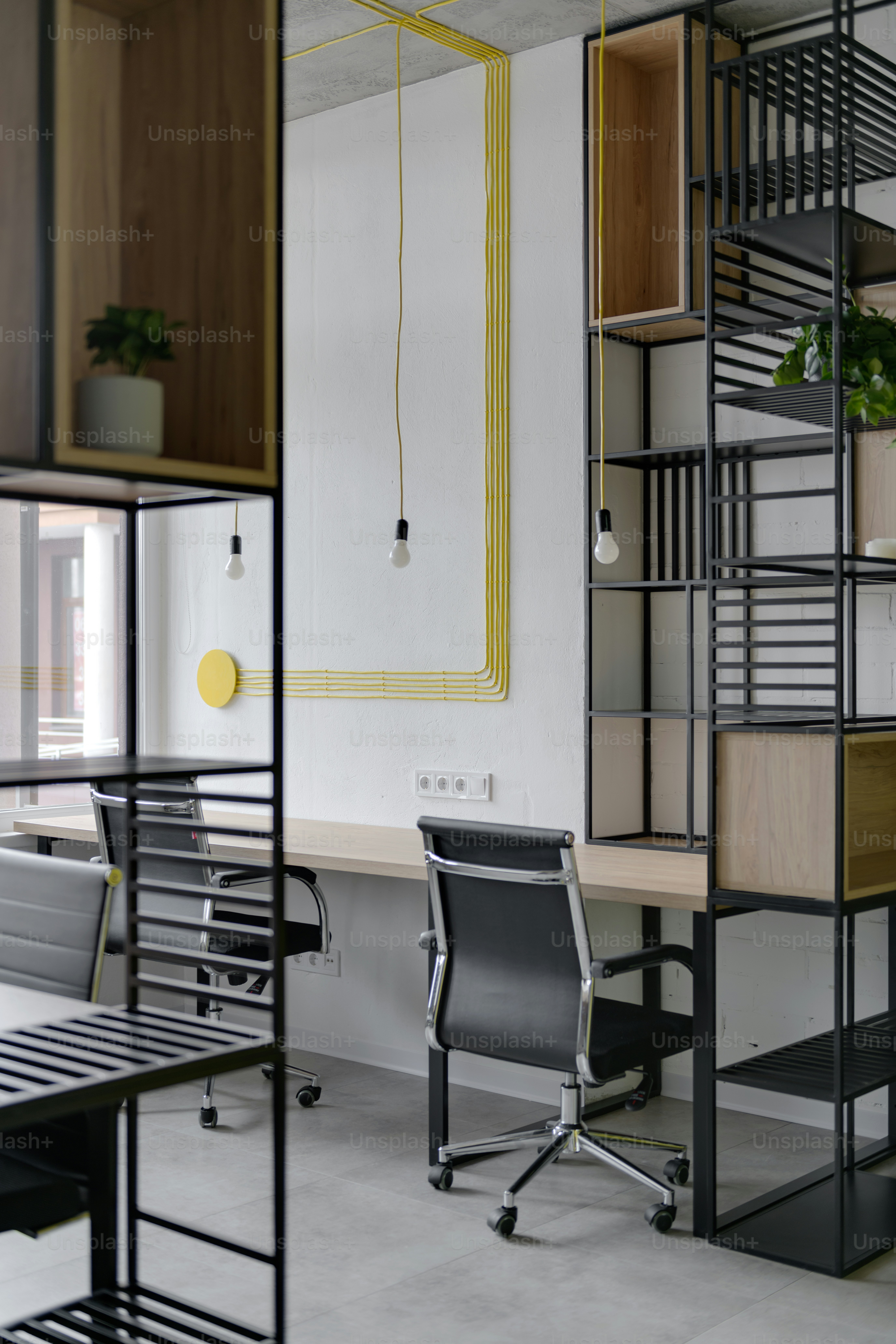 a room with a desk, chair and shelves