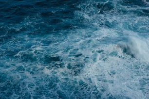 a large body of water with a wave coming in