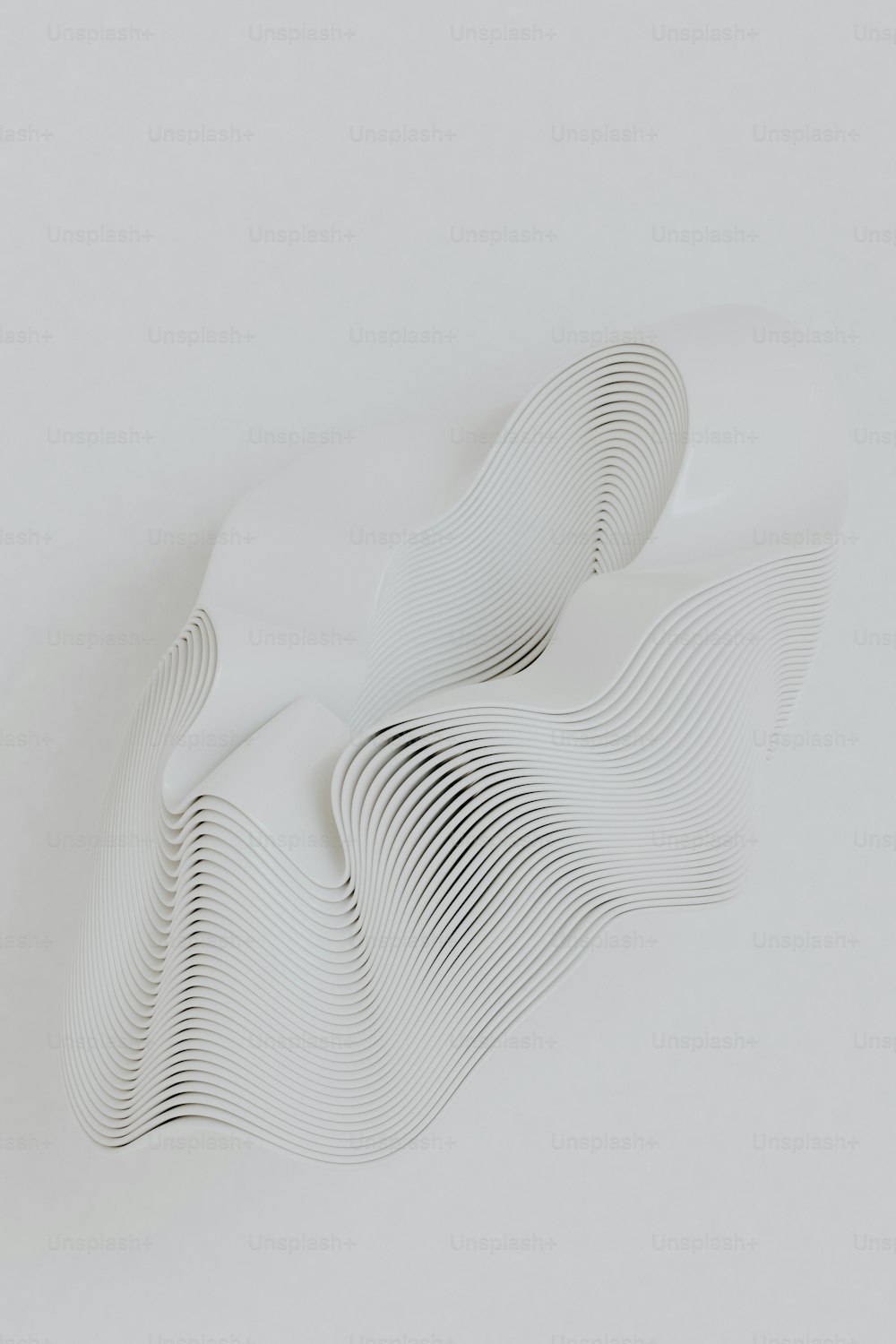 a white sculpture is shown against a white background