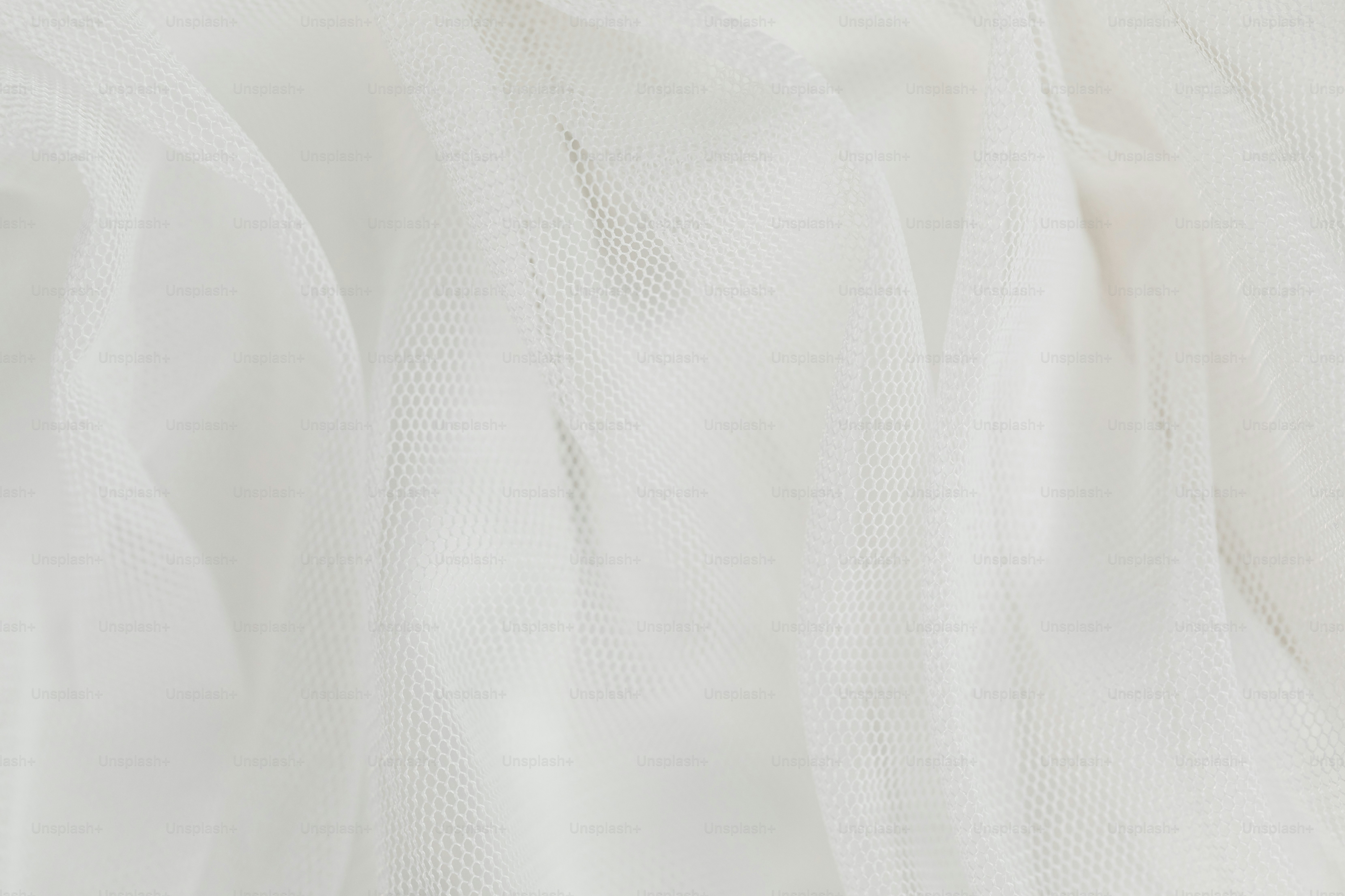 A close up of a white sheer fabric photo White backgrounds Image on