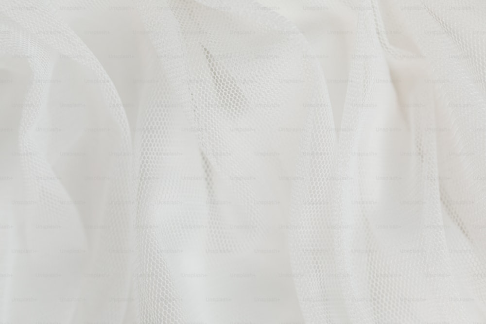 a close up of a white sheer fabric