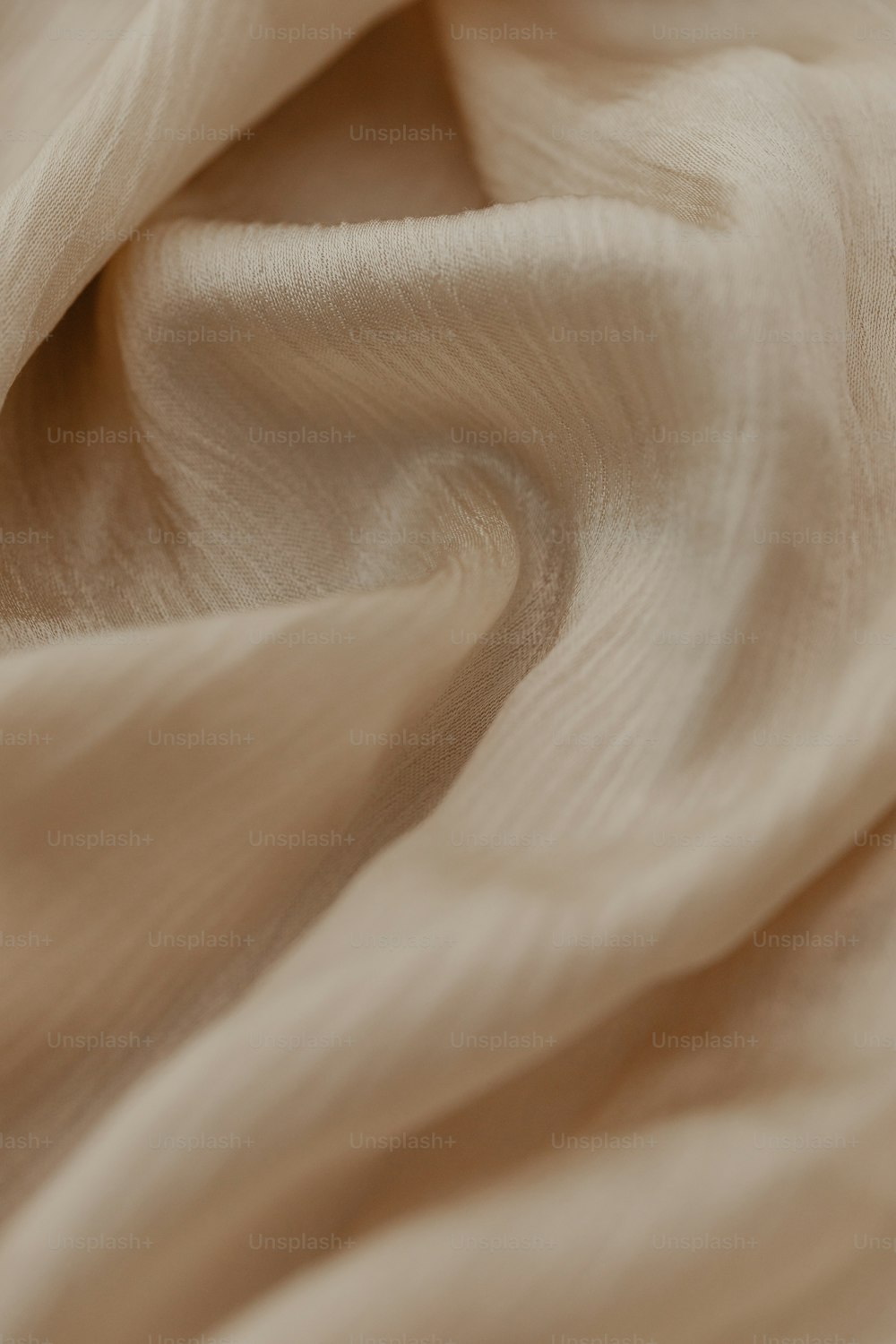 a close up view of a beige fabric