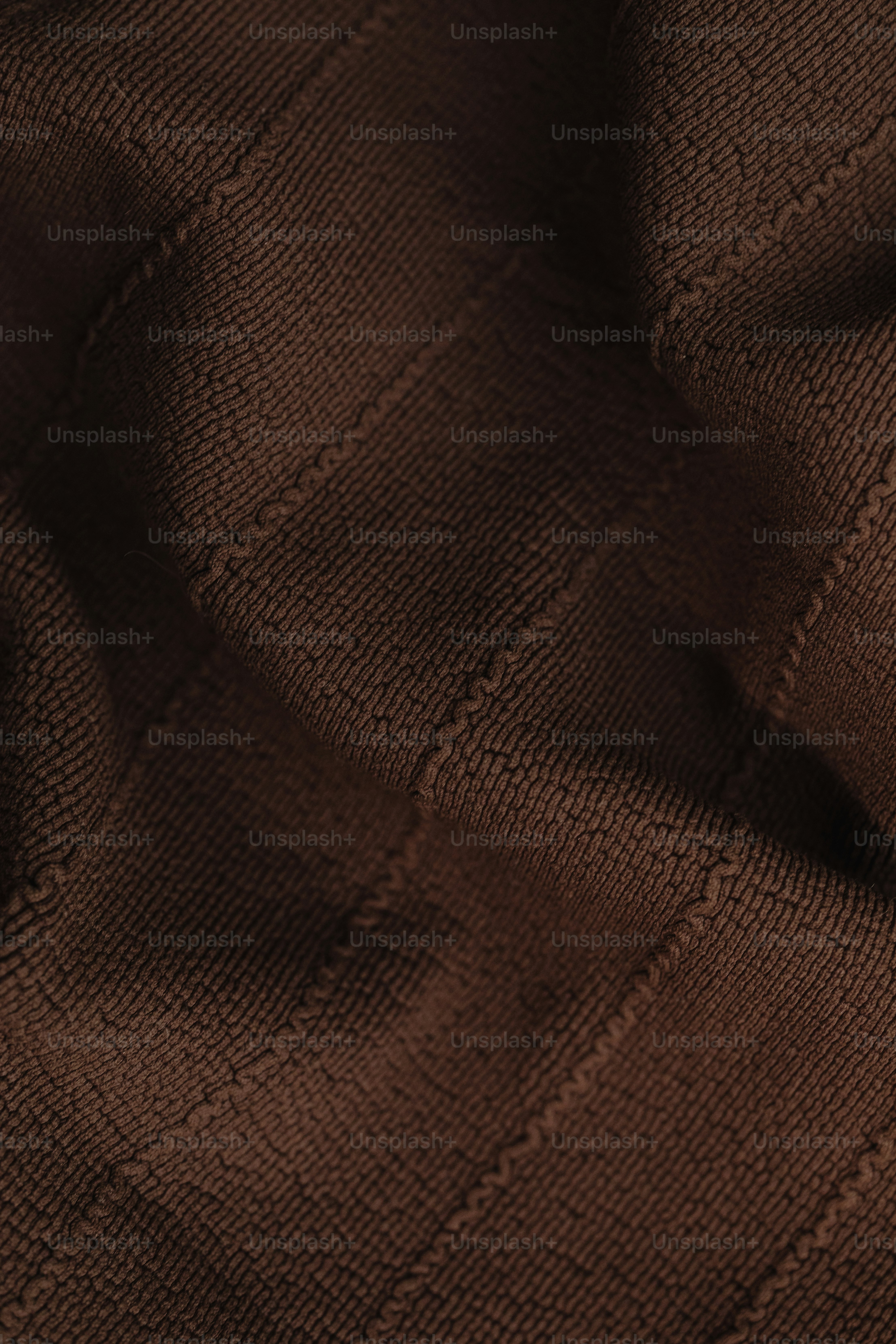a close up of a brown sweater