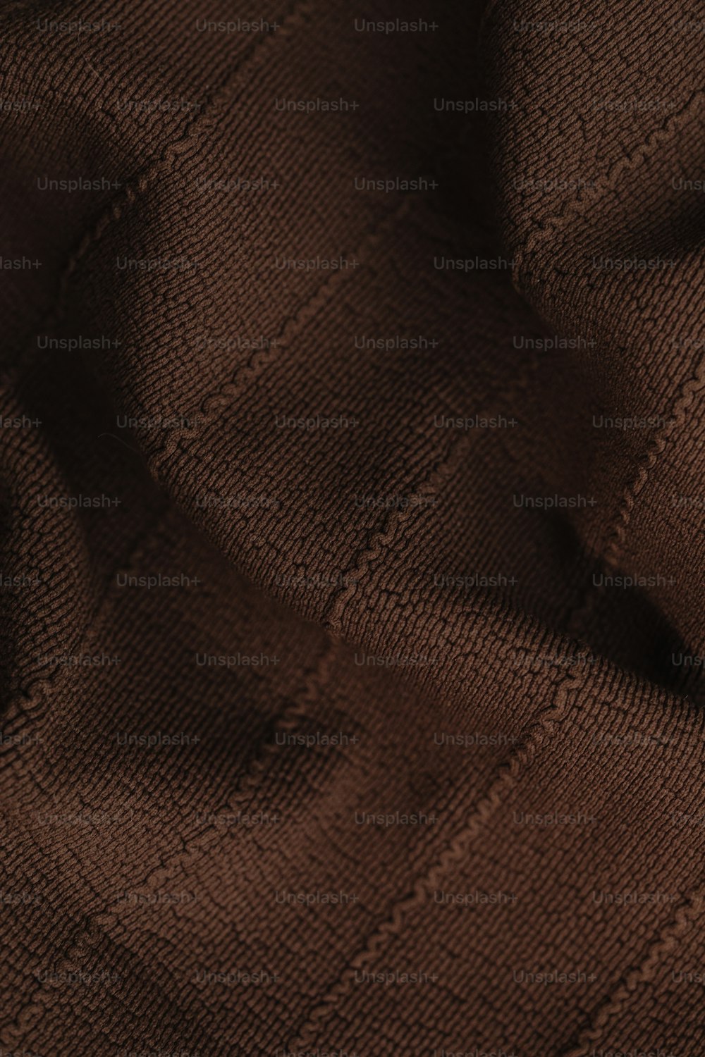 a close up of a brown sweater