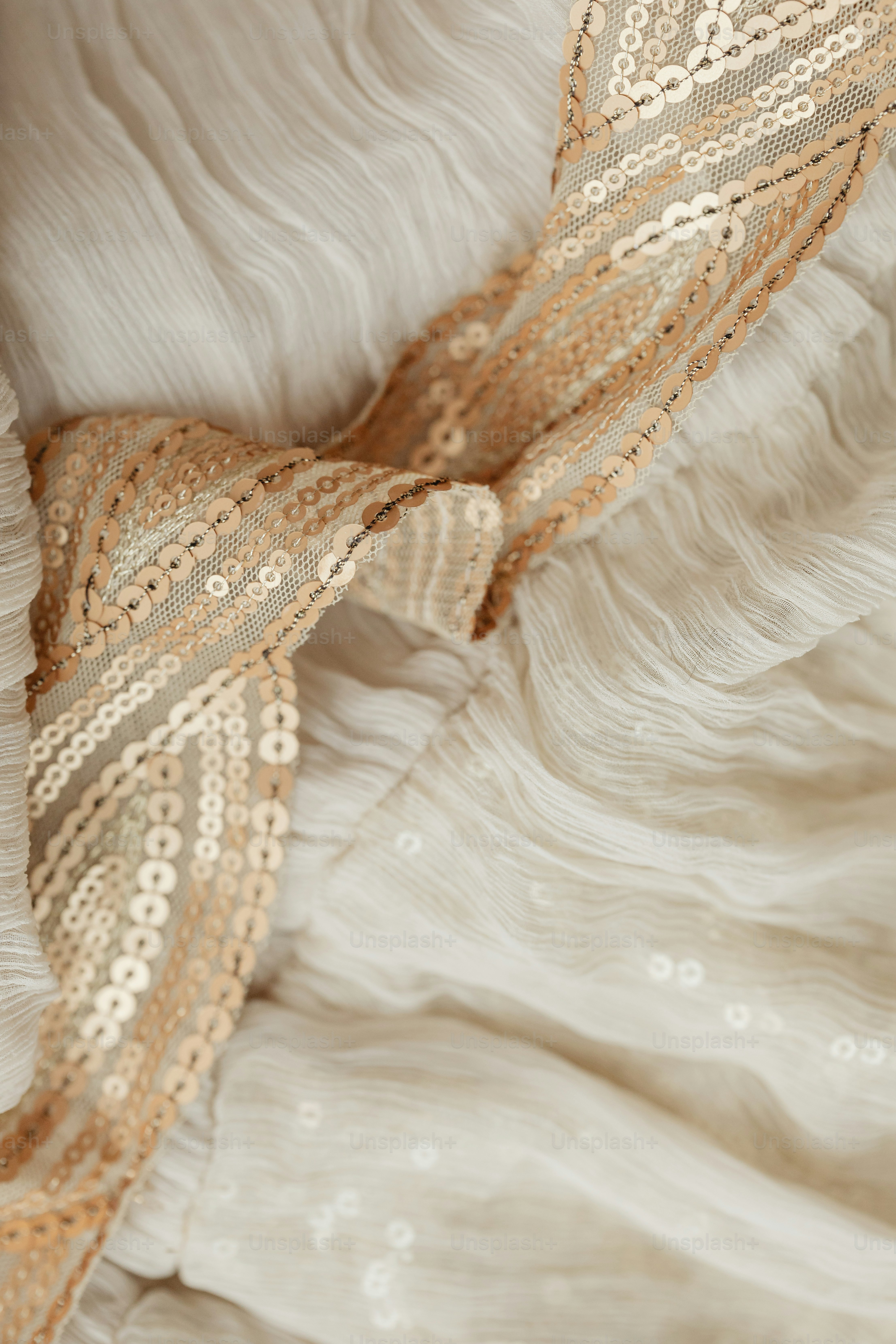 a close up of a tie on a bed