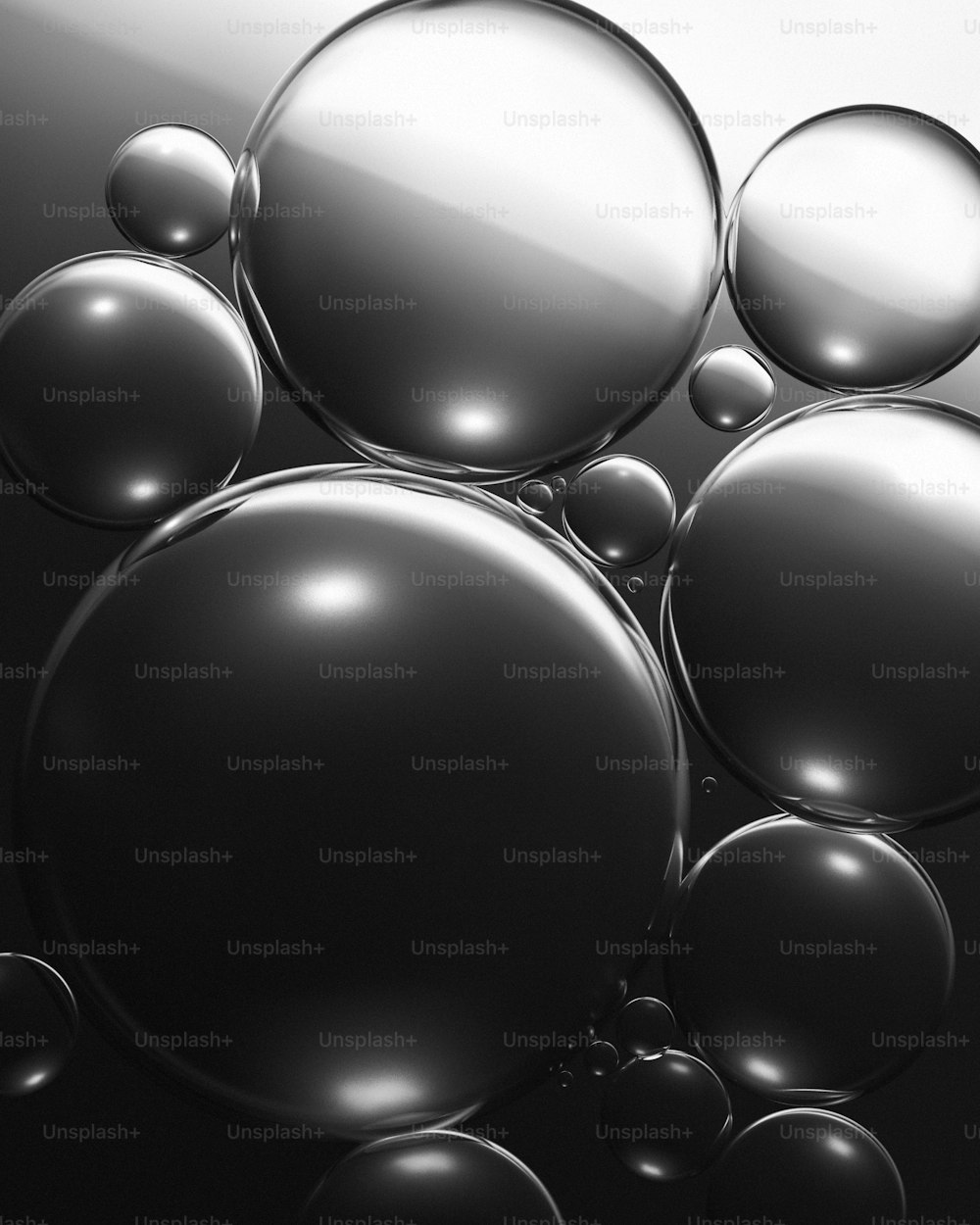 a black and white photo of a bunch of bubbles