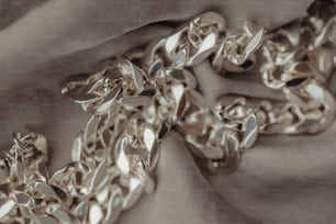 a close up of a chain on a cloth