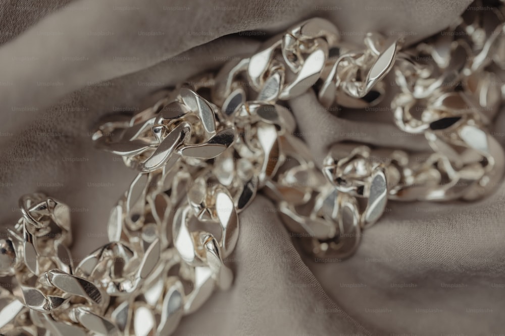 a close up of a chain on a cloth