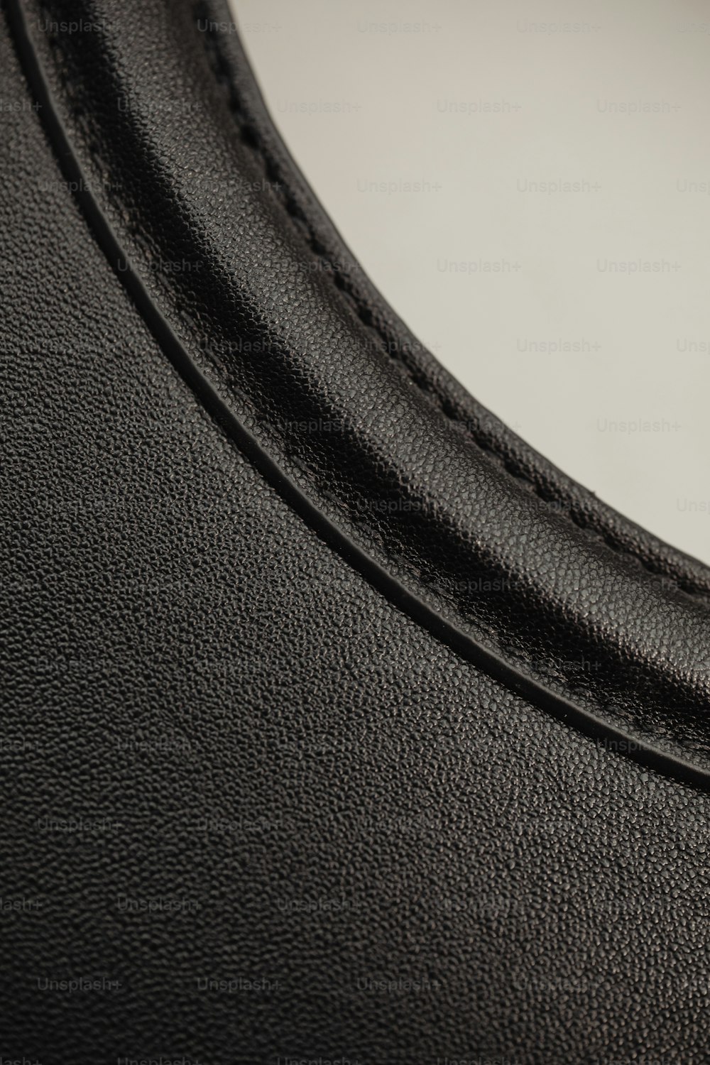 a close up of a black leather material