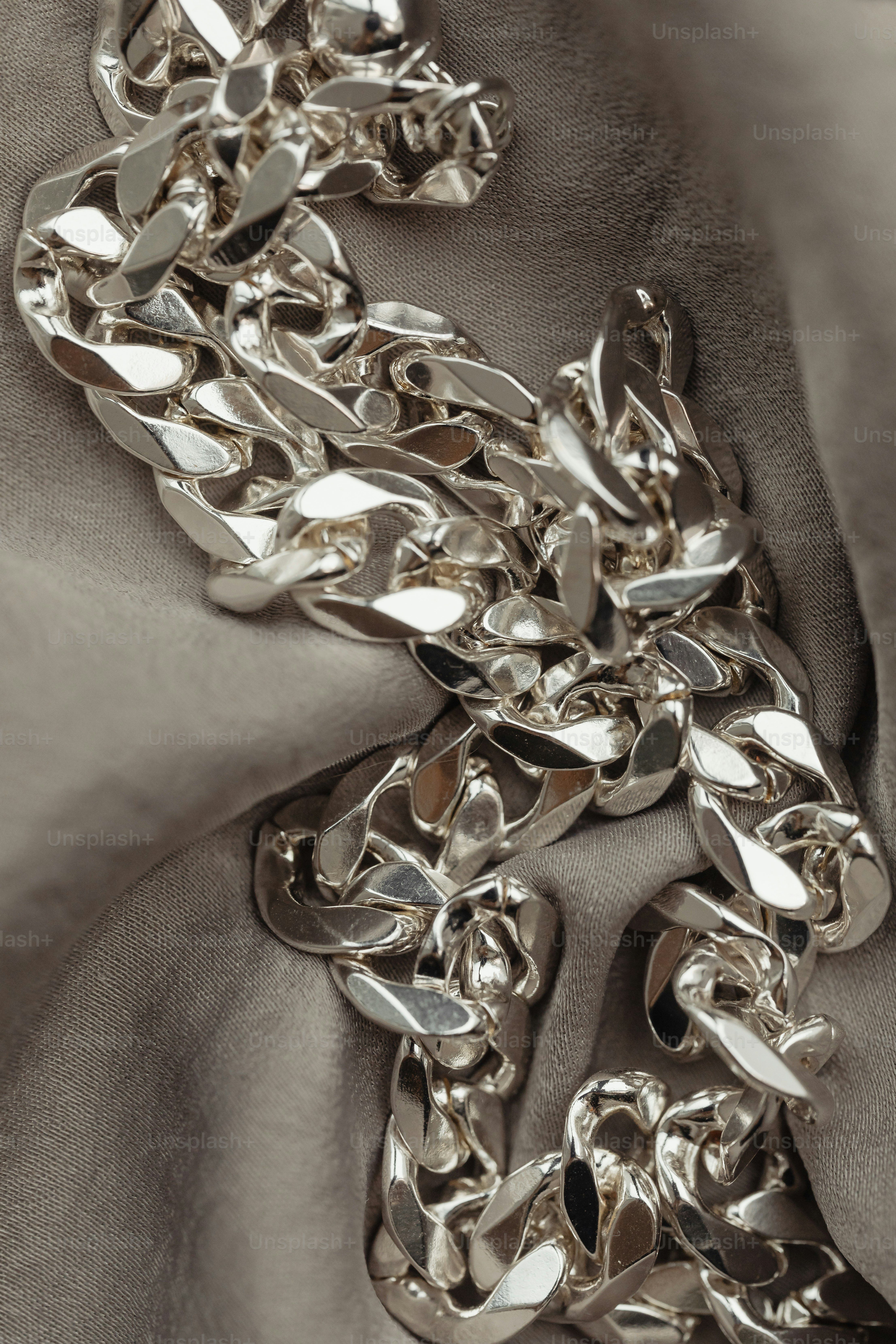 a close up of a chain on a cloth