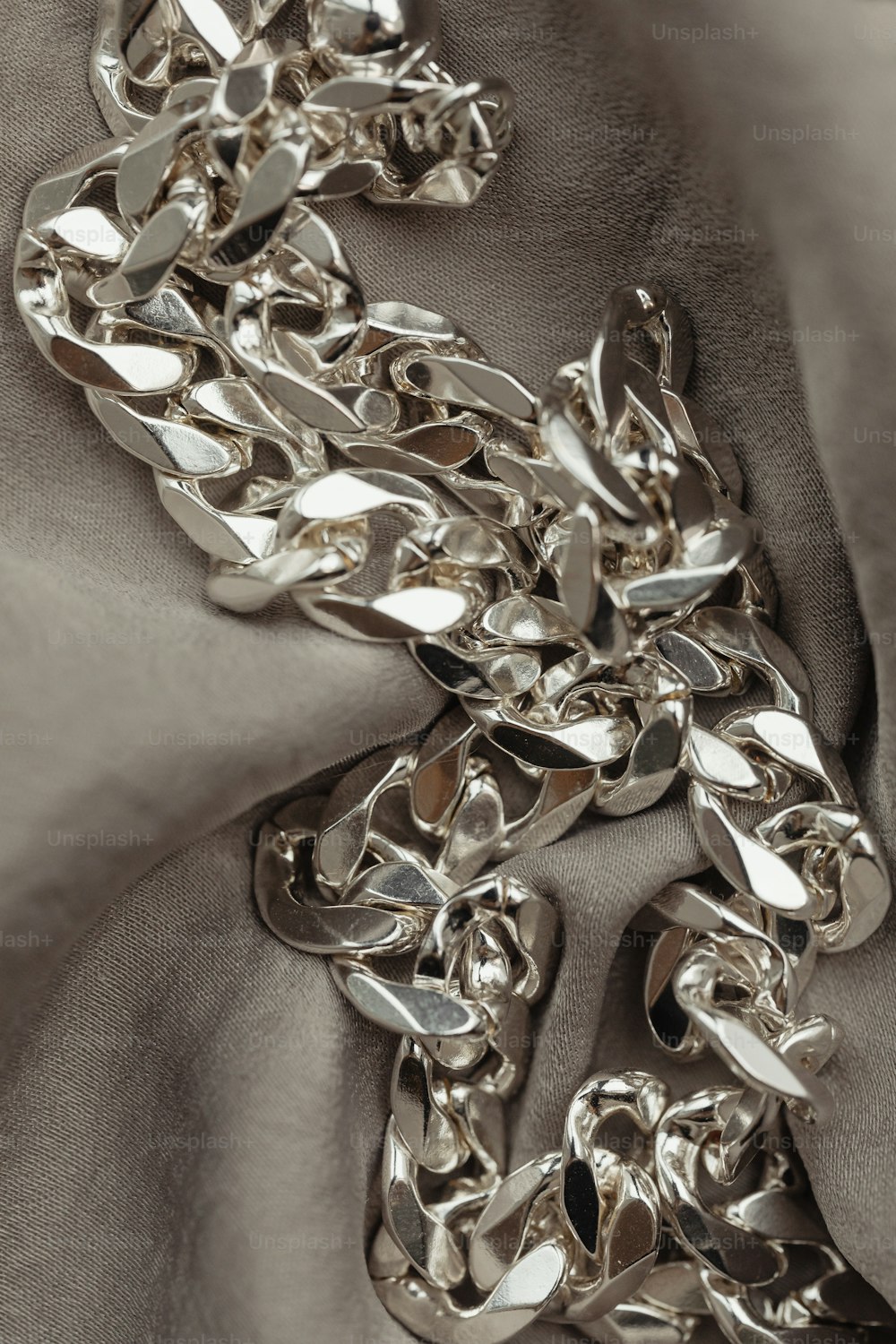 a close up of a chain on a cloth