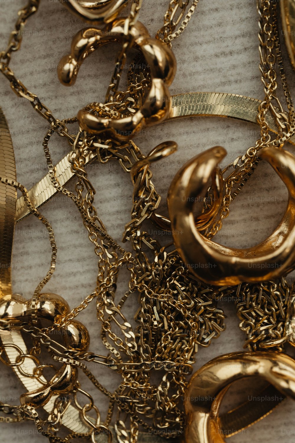 a close up of a bunch of gold jewelry