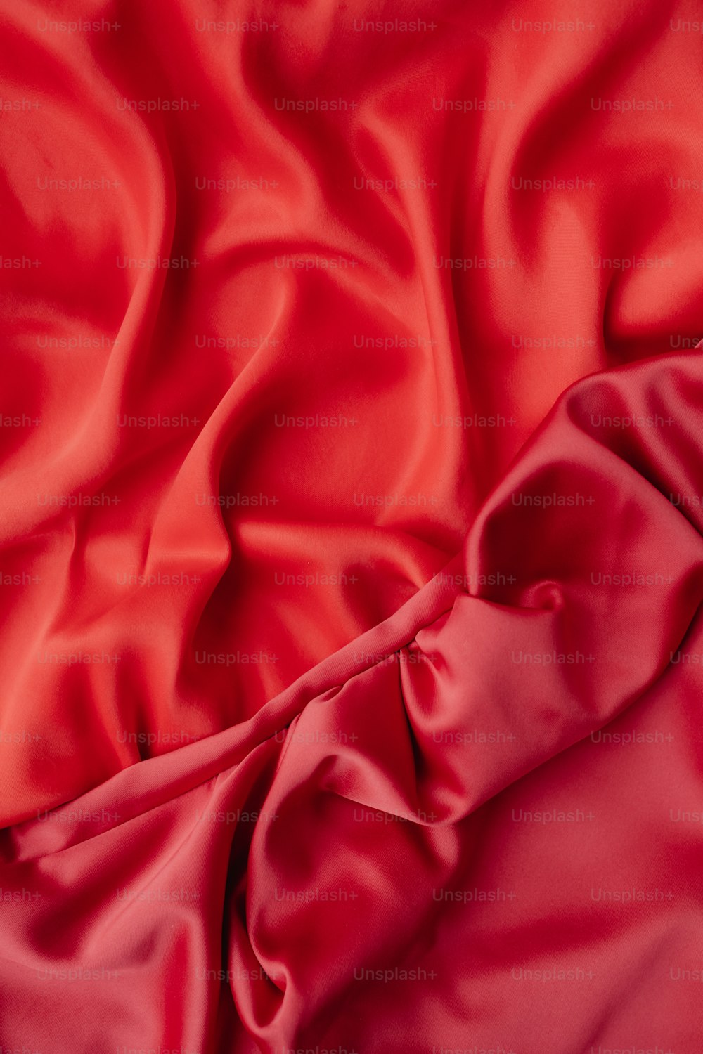 a close up of a red satin fabric