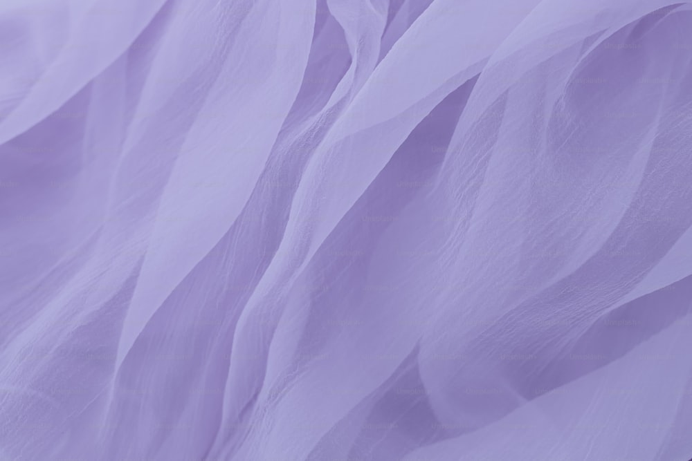 a close up of a purple sheer fabric